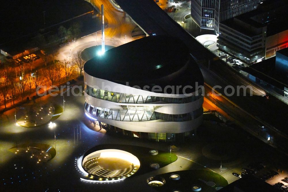 Aerial photograph at night Stuttgart - Night lighting museum building ensemble Mercedes-Benz Museum on Mercedesstrasse in the district Untertuerkheim in Stuttgart in the state Baden-Wurttemberg, Germany