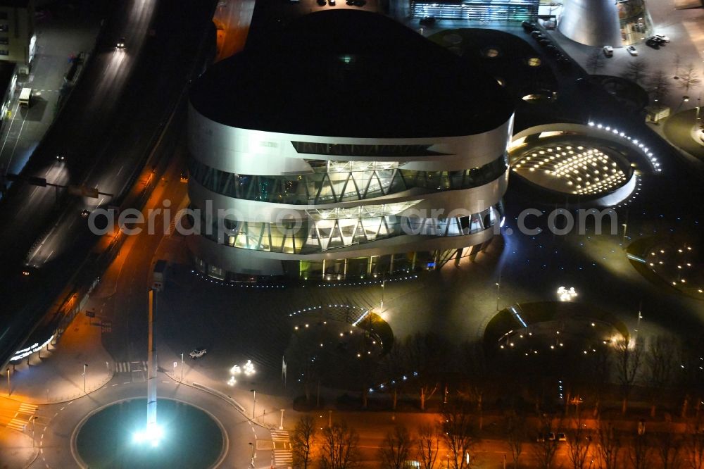 Aerial image at night Stuttgart - Night lighting museum building ensemble Mercedes-Benz Museum on Mercedesstrasse in the district Untertuerkheim in Stuttgart in the state Baden-Wurttemberg, Germany