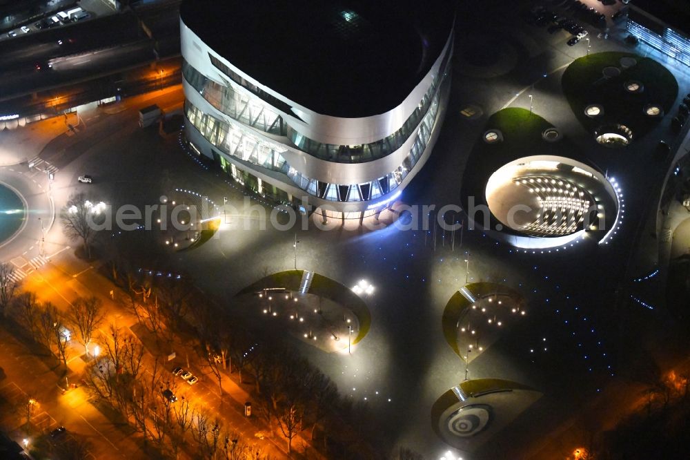 Stuttgart at night from the bird perspective: Night lighting museum building ensemble Mercedes-Benz Museum on Mercedesstrasse in the district Untertuerkheim in Stuttgart in the state Baden-Wurttemberg, Germany