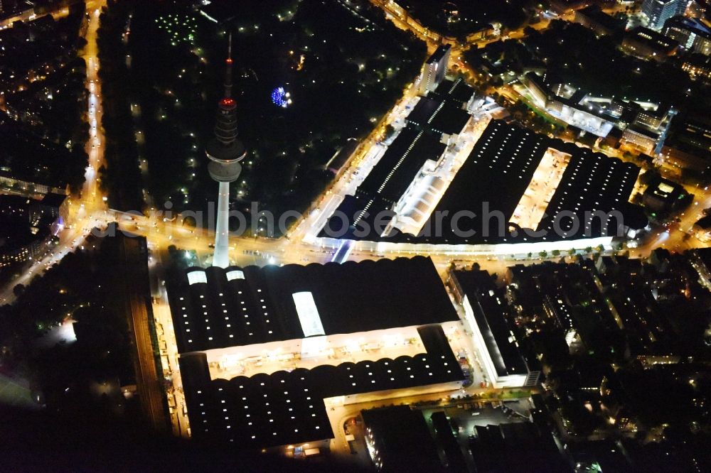 Aerial image at night Hamburg - Night view of tv- tower on Exhibition grounds and exhibition halls of the Hamburg Messe und Congress GmbH in Hamburg