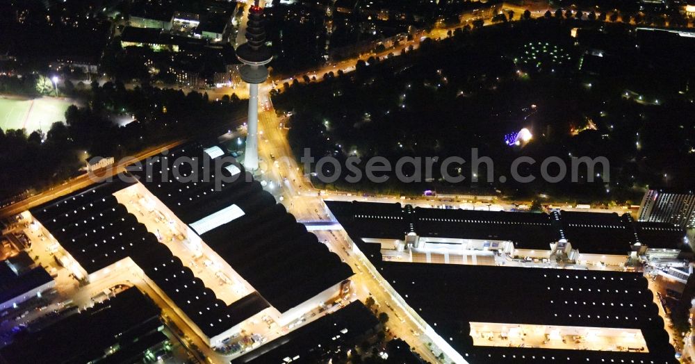 Hamburg at night from the bird perspective: Night view of tv- tower on Exhibition grounds and exhibition halls of the Hamburg Messe und Congress GmbH in Hamburg