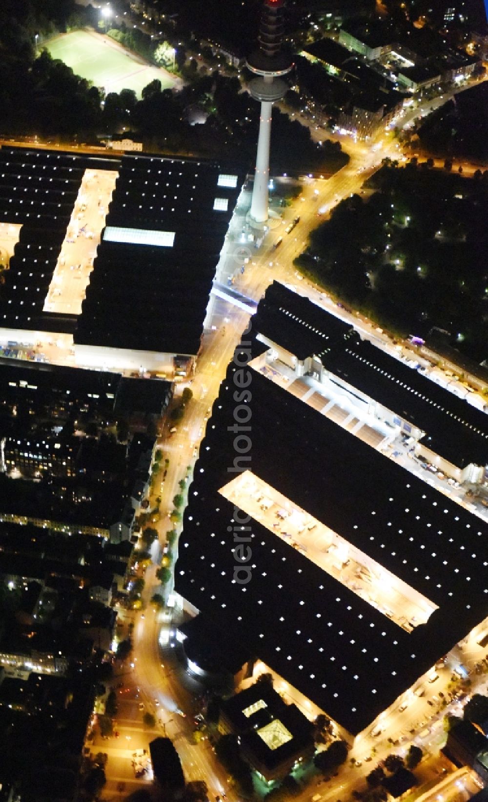 Aerial image at night Hamburg - Night view of tv- tower on Exhibition grounds and exhibition halls of the Hamburg Messe und Congress GmbH in Hamburg