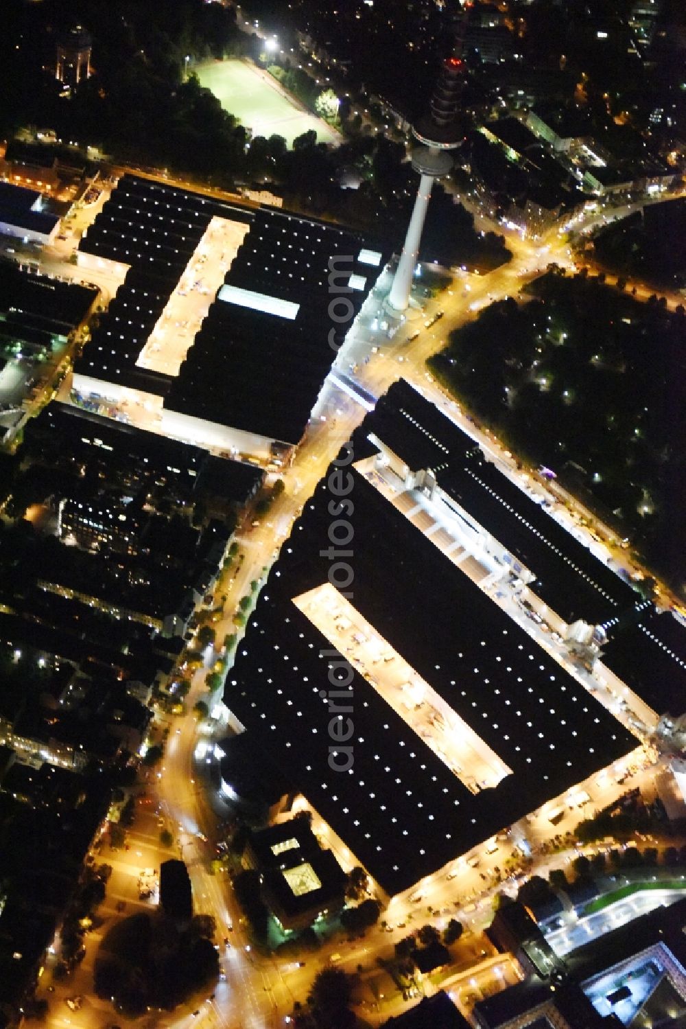 Hamburg at night from above - Night view of tv- tower on Exhibition grounds and exhibition halls of the Hamburg Messe und Congress GmbH in Hamburg