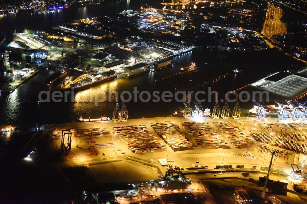 Hamburg at night from the bird perspective: Night view of Container Terminal in the port of the international port of HHLA Logistics Container Terminal Eurogate in Hamburg