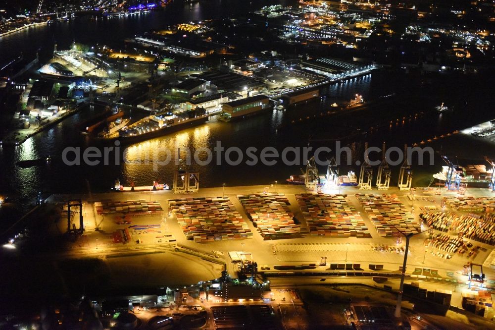 Hamburg at night from the bird perspective: Night view of Container Terminal in the port of the international port of HHLA Logistics Container Terminal Eurogate in Hamburg