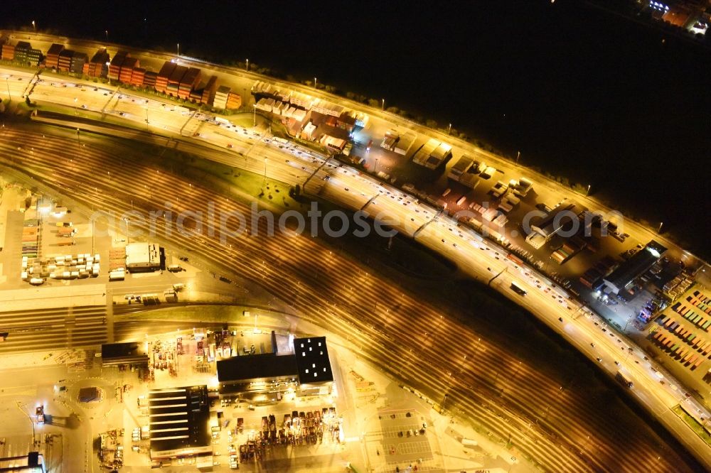 Hamburg at night from the bird perspective: Night view of Container Terminal in the port of the international port of HHLA Logistics Container Terminal Eurogate in Hamburg