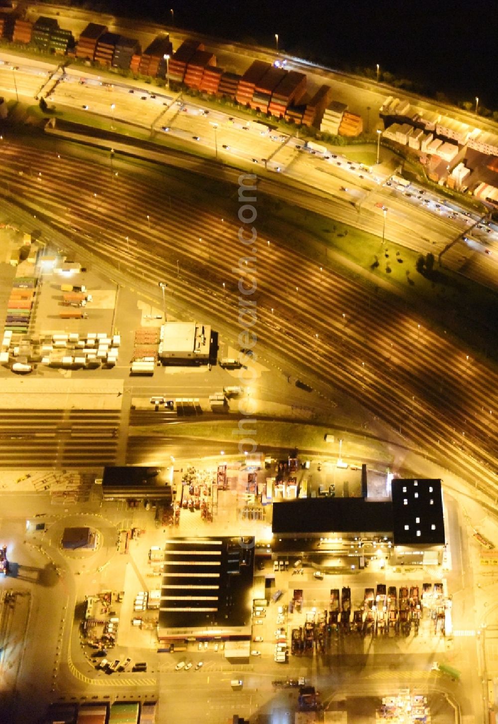 Aerial photograph at night Hamburg - Night view of Container Terminal in the port of the international port of HHLA Logistics Container Terminal Eurogate in Hamburg