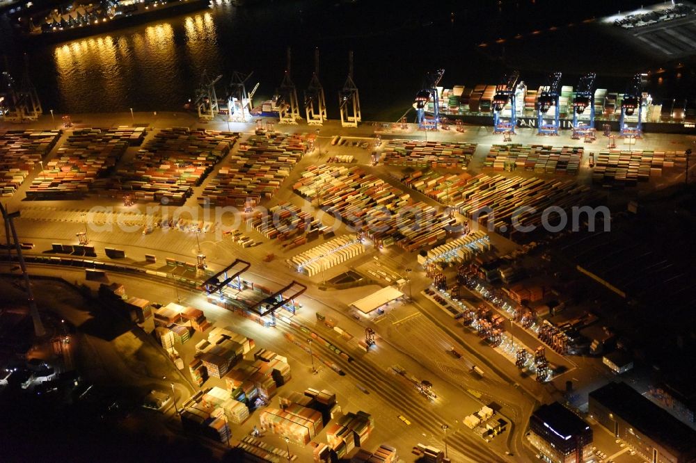 Hamburg at night from the bird perspective: Night view of Container Terminal in the port of the international port of HHLA Logistics Container Terminal Eurogate in Hamburg