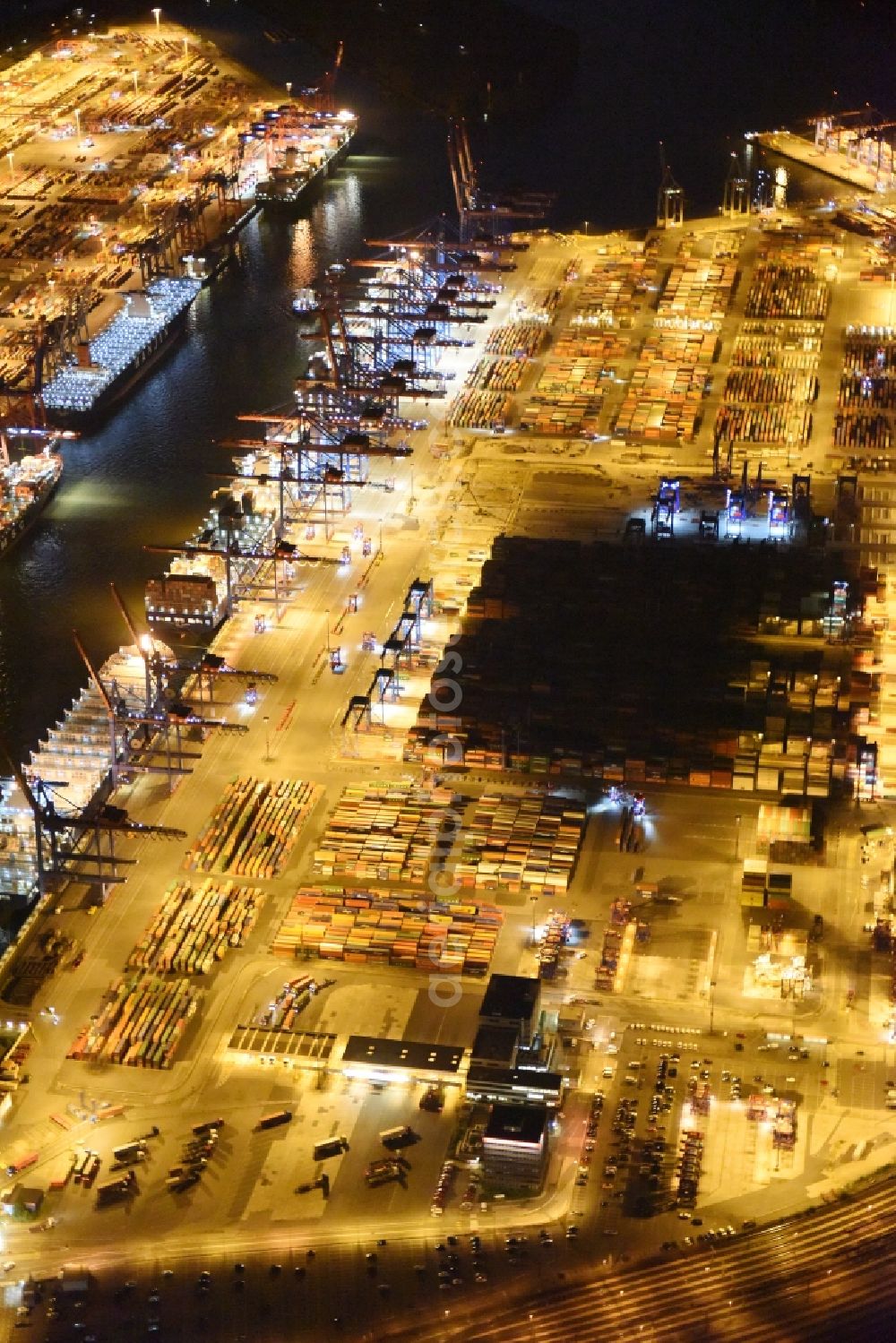 Aerial image at night Hamburg - Night view of Container Terminal in the port of the international port of HHLA Logistics Container Terminal Eurogate in Hamburg