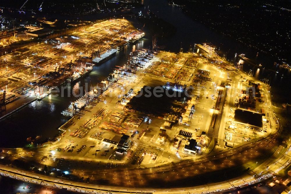 Hamburg at night from the bird perspective: Night view of Container Terminal in the port of the international port of HHLA Logistics Container Terminal Eurogate in Hamburg