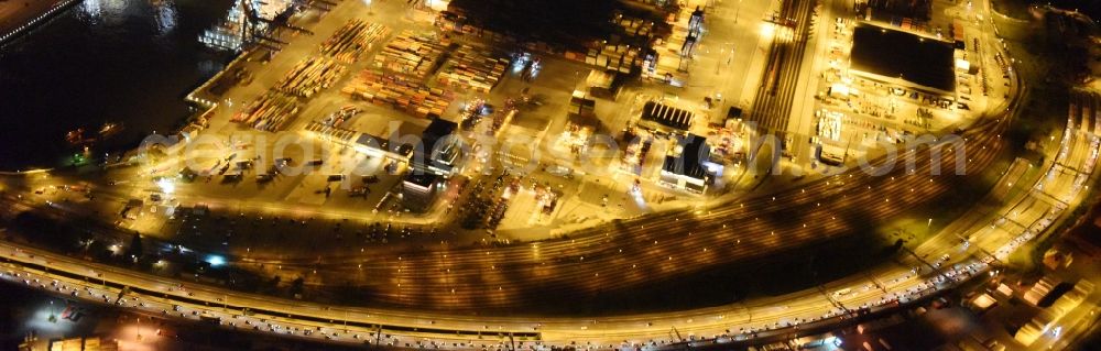 Aerial photograph at night Hamburg - Night view of Container Terminal in the port of the international port of HHLA Logistics Container Terminal Eurogate in Hamburg