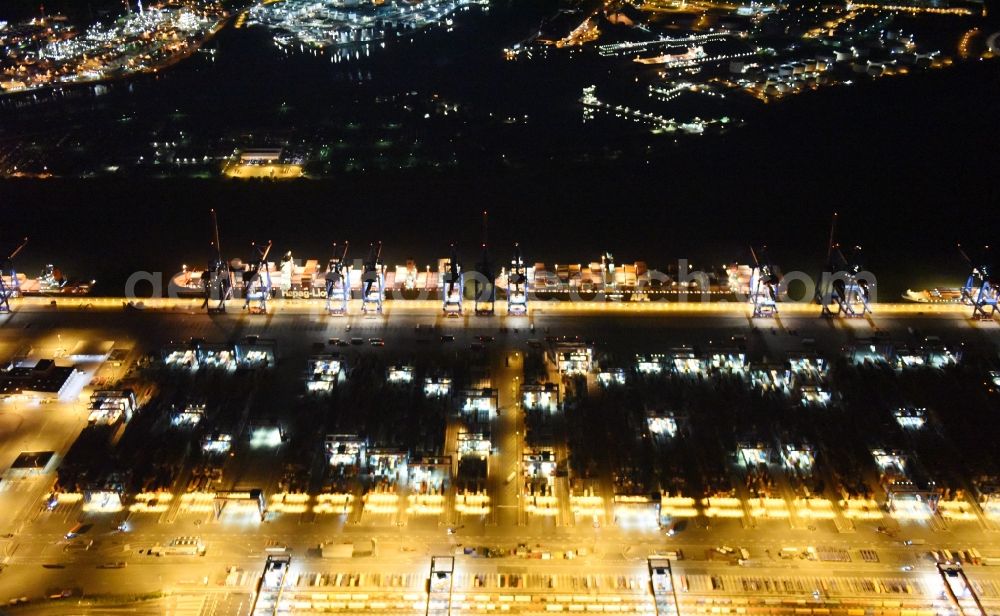 Hamburg at night from above - Night view of Container Terminal in the port of the international port of HHLA Logistics Container Terminal Eurogate in Hamburg