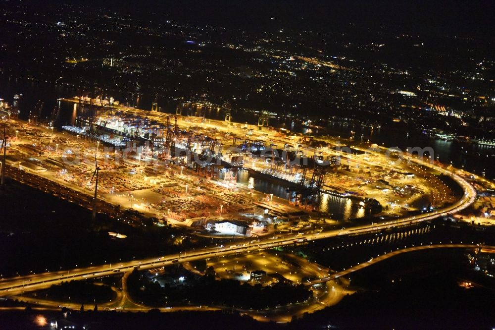 Hamburg at night from the bird perspective: Night view of Container Terminal in the port of the international port of HHLA Logistics Container Terminal Eurogate in Hamburg