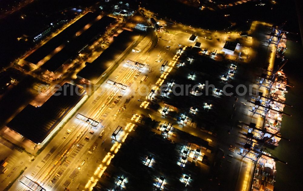 Aerial photograph at night Hamburg - Night view of Container Terminal in the port of the international port of HHLA Logistics Container Terminal Eurogate in Hamburg