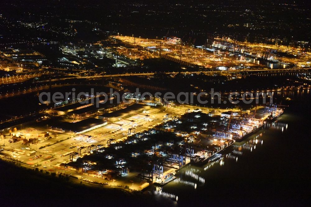 Hamburg at night from the bird perspective: Night view of Container Terminal in the port of the international port of HHLA Logistics Container Terminal Eurogate in Hamburg