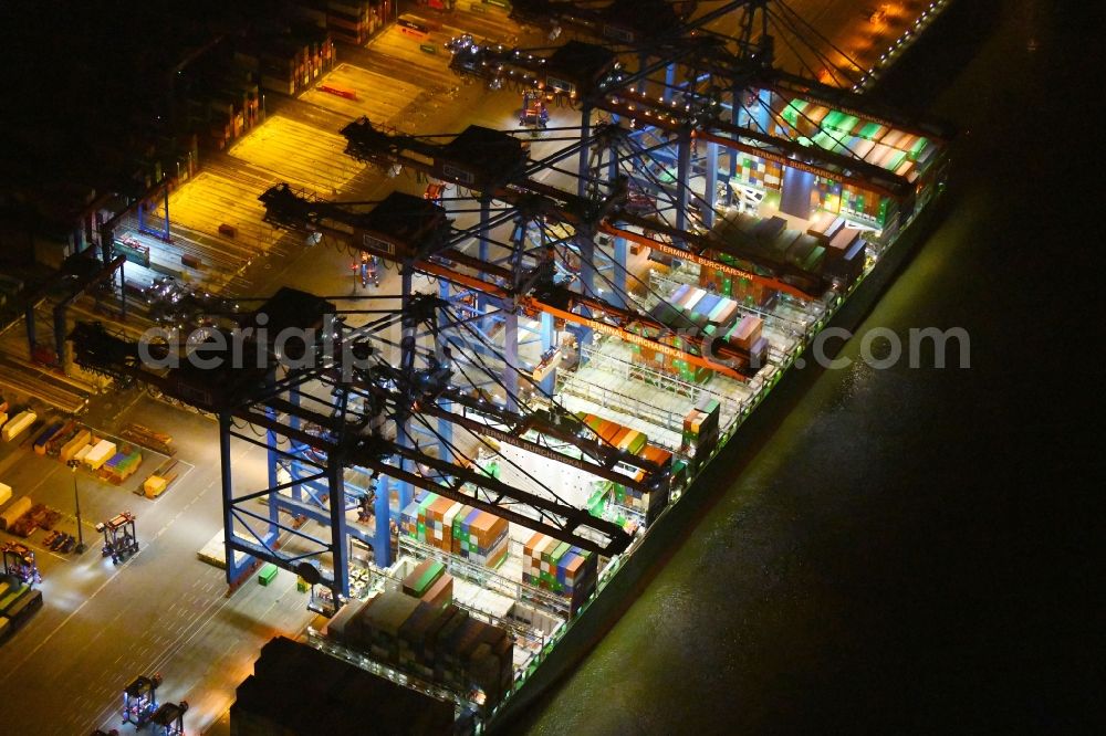 Hamburg at night from above - Night view of Container Terminal in the port of the international port of HHLA Logistics Container Terminal Eurogate in Hamburg