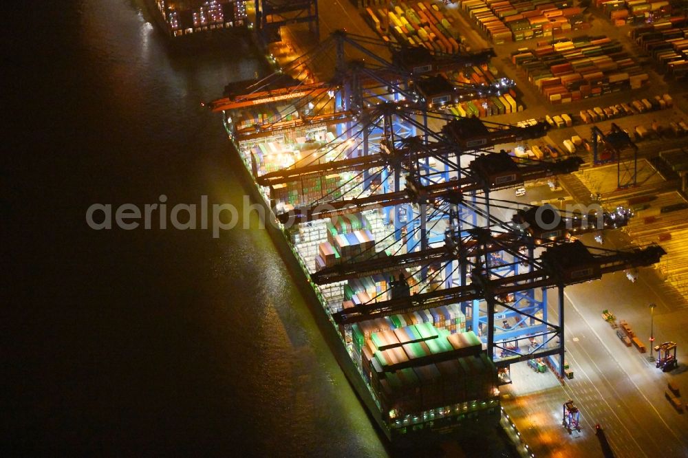 Aerial image at night Hamburg - Night view of Container Terminal in the port of the international port of HHLA Logistics Container Terminal Eurogate in Hamburg