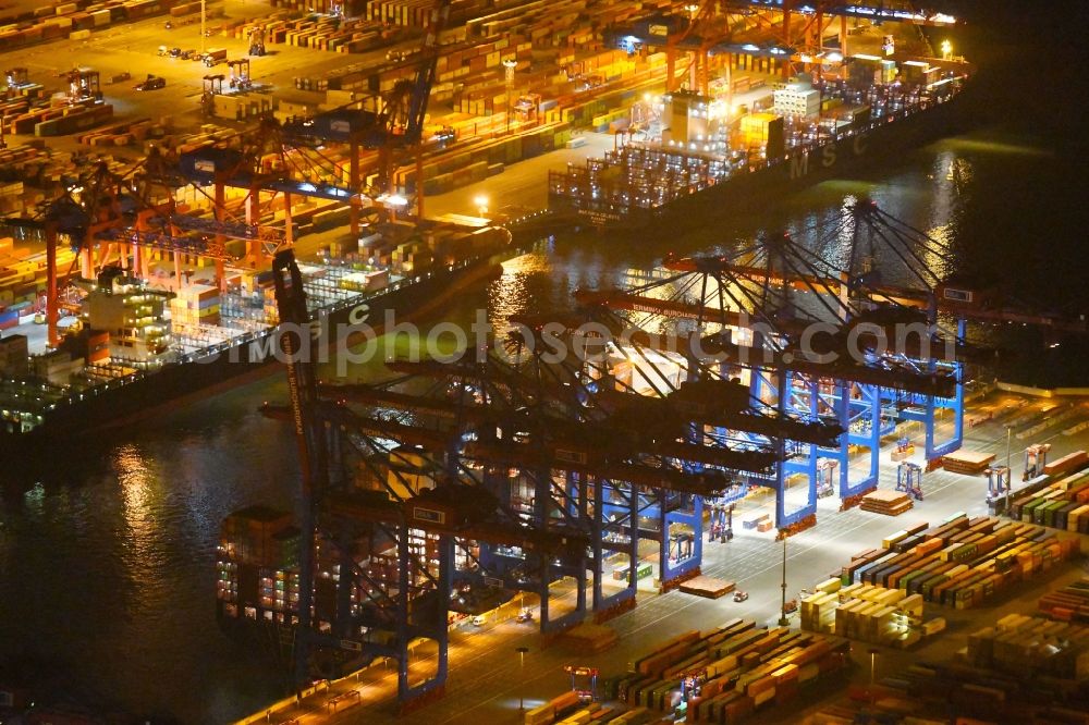 Aerial photograph at night Hamburg - Night view of Container Terminal in the port of the international port of HHLA Logistics Container Terminal Eurogate in Hamburg