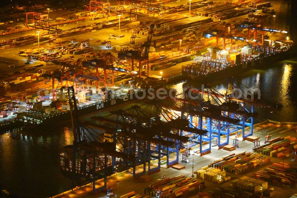 Aerial image at night Hamburg - Night view of Container Terminal in the port of the international port of HHLA Logistics Container Terminal Eurogate in Hamburg