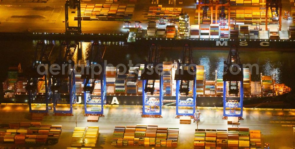 Aerial photograph at night Hamburg - Night view of Container Terminal in the port of the international port of HHLA Logistics Container Terminal Eurogate in Hamburg