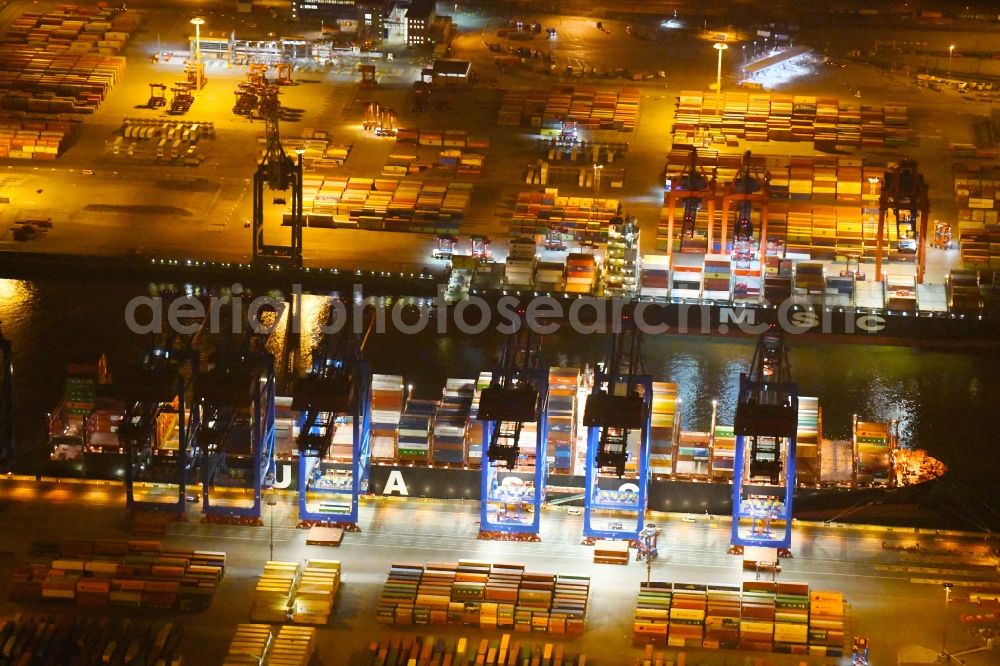 Aerial image at night Hamburg - Night view of Container Terminal in the port of the international port of HHLA Logistics Container Terminal Eurogate in Hamburg