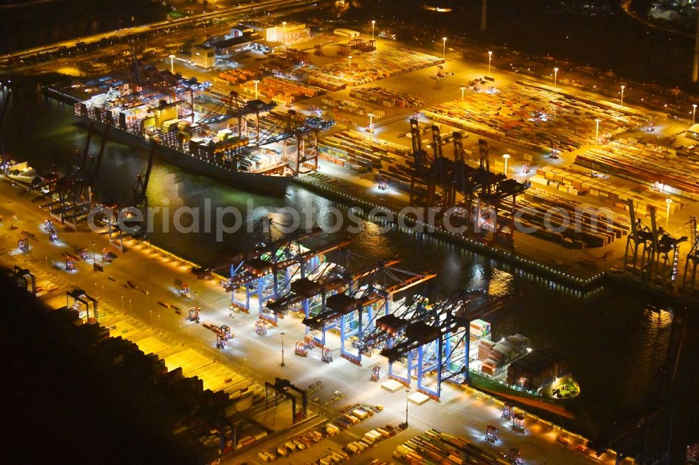 Hamburg at night from the bird perspective: Night view of Container Terminal in the port of the international port of HHLA Logistics Container Terminal Eurogate in Hamburg