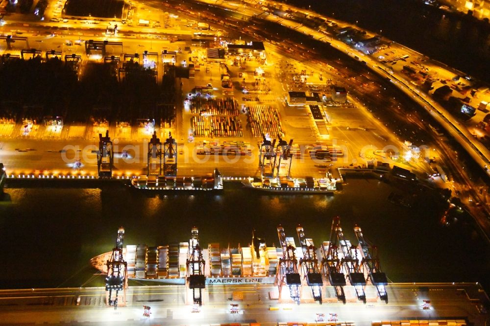 Aerial photograph at night Hamburg - Night view of Container Terminal in the port of the international port of HHLA Logistics Container Terminal Eurogate in Hamburg