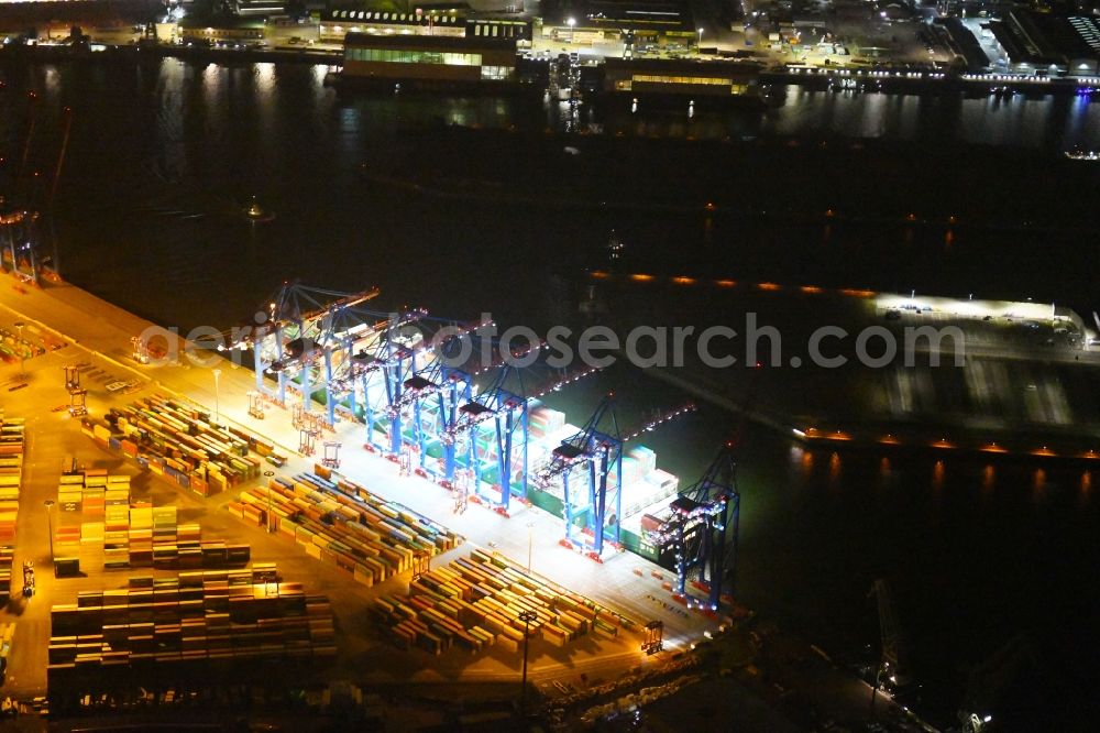 Aerial photograph at night Hamburg - Night view of Container Terminal in the port of the international port of HHLA Logistics Container Terminal Eurogate in Hamburg