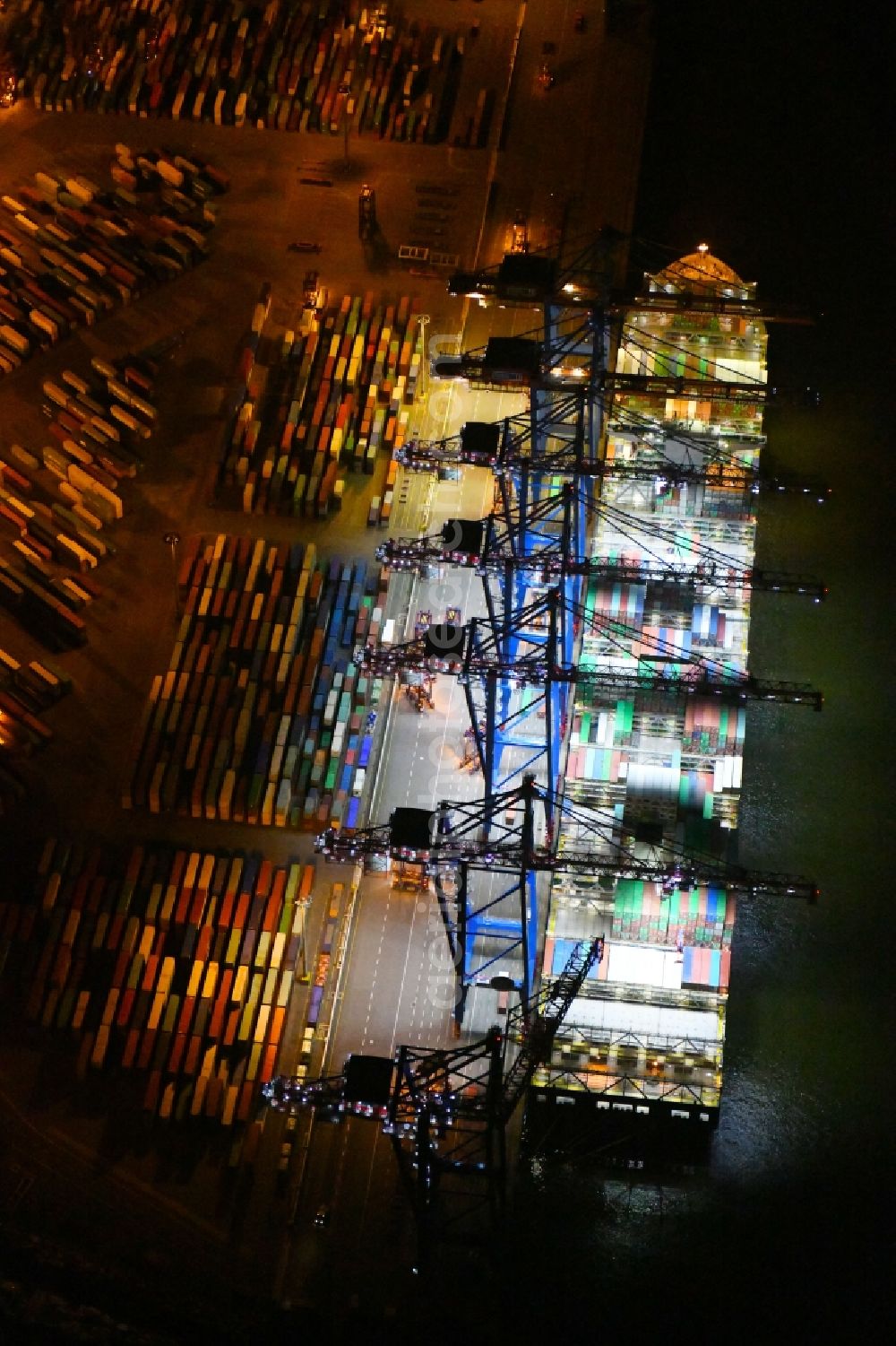 Aerial photograph at night Hamburg - Night view of Container Terminal in the port of the international port of HHLA Logistics Container Terminal Eurogate in Hamburg