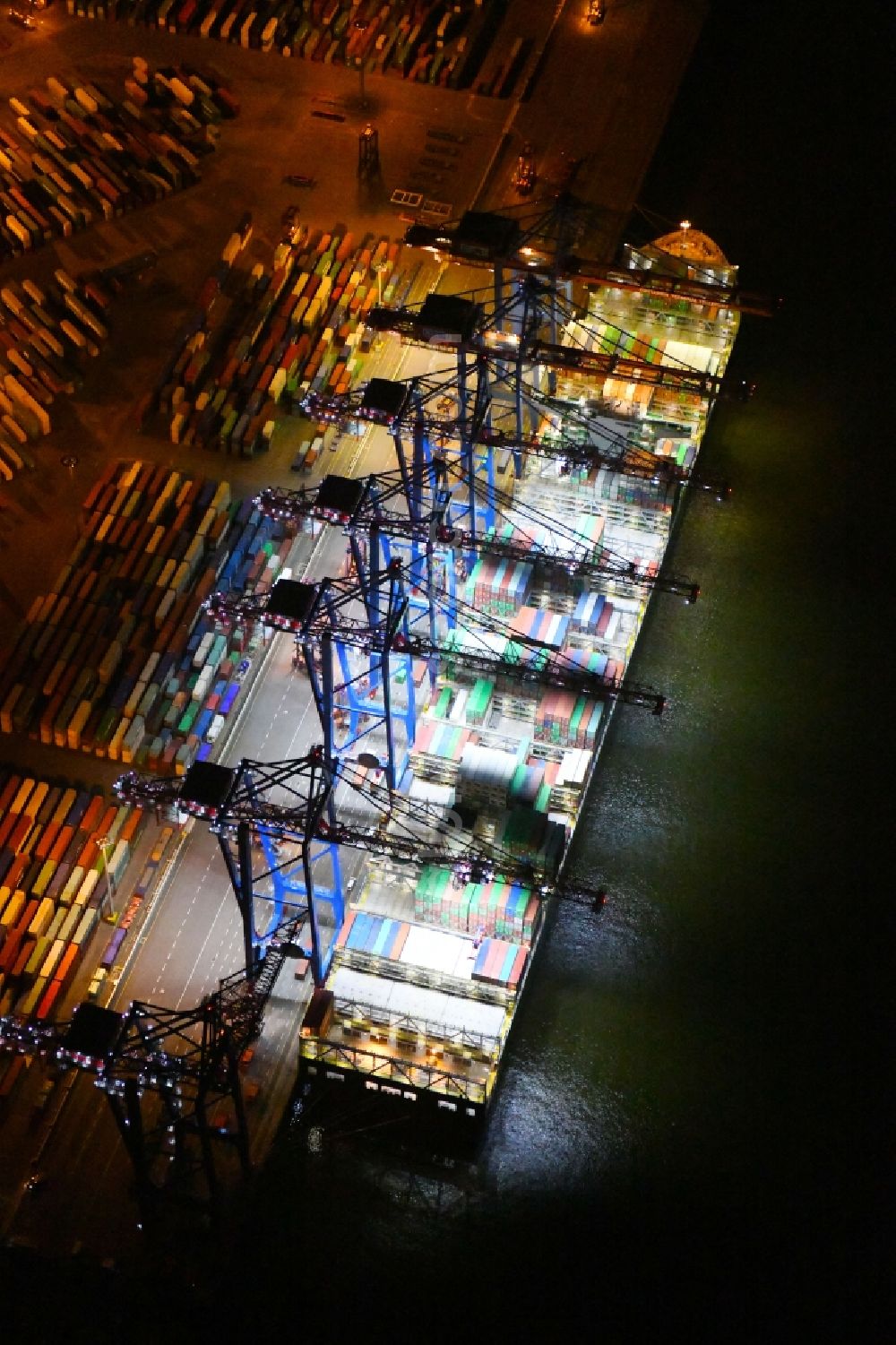 Aerial image at night Hamburg - Night view of Container Terminal in the port of the international port of HHLA Logistics Container Terminal Eurogate in Hamburg