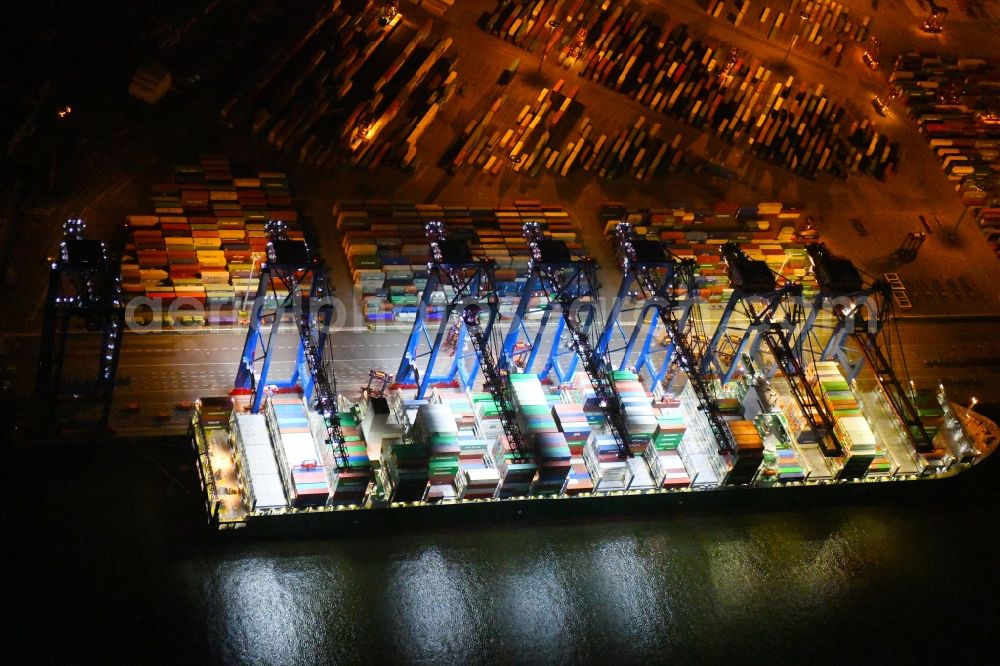 Hamburg at night from the bird perspective: Night view of Container Terminal in the port of the international port of HHLA Logistics Container Terminal Eurogate in Hamburg