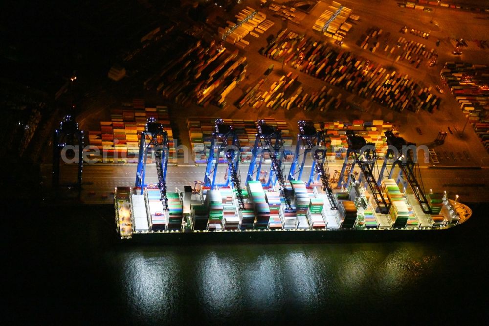 Aerial photograph at night Hamburg - Night view of Container Terminal in the port of the international port of HHLA Logistics Container Terminal Eurogate in Hamburg