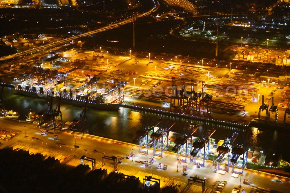 Aerial photograph at night Hamburg - Night view of Container Terminal in the port of the international port of HHLA Logistics Container Terminal Eurogate in Hamburg