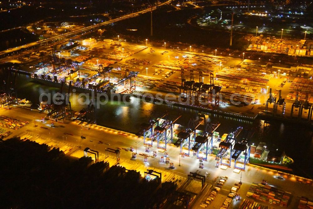 Aerial image at night Hamburg - Night view of Container Terminal in the port of the international port of HHLA Logistics Container Terminal Eurogate in Hamburg