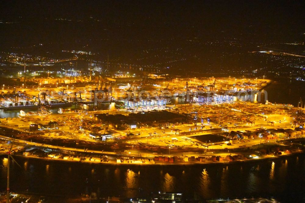 Hamburg at night from the bird perspective: Night view of Container Terminal in the port of the international port of HHLA Logistics Container Terminal Eurogate in Hamburg