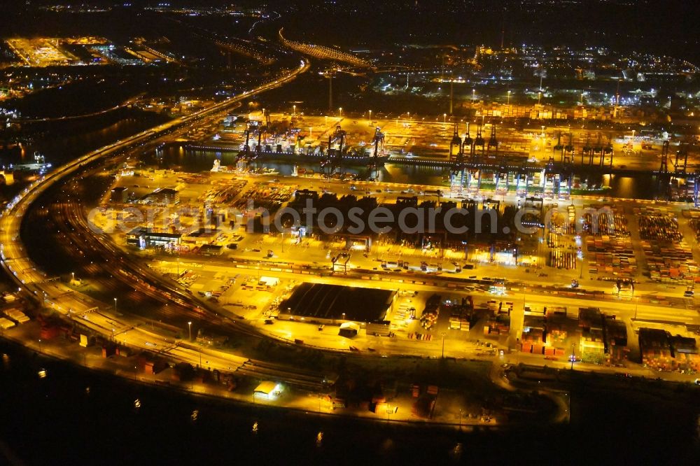 Hamburg at night from the bird perspective: Night view of Container Terminal in the port of the international port of HHLA Logistics Container Terminal Eurogate in Hamburg