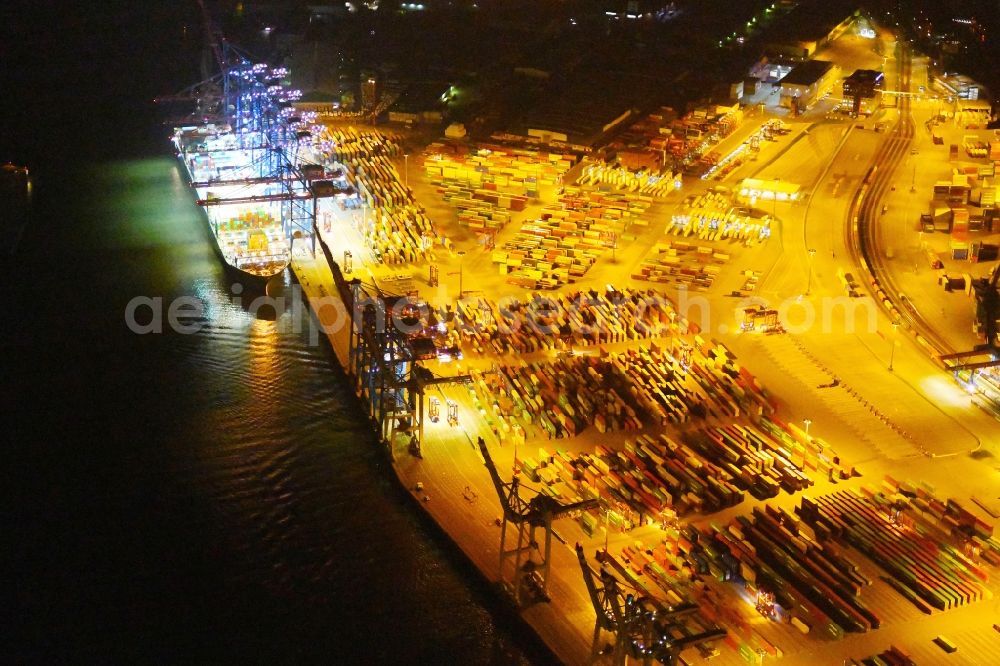 Hamburg at night from above - Night view of Container Terminal in the port of the international port of HHLA Logistics Container Terminal Eurogate in Hamburg