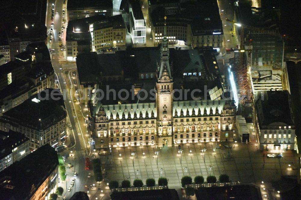 Aerial image at night Hamburg - Night view of Town Hall building of the City Council at the market downtown in Hamburg