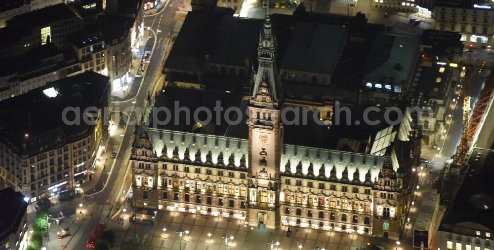 Aerial photograph at night Hamburg - Night view of Town Hall building of the City Council at the market downtown in Hamburg