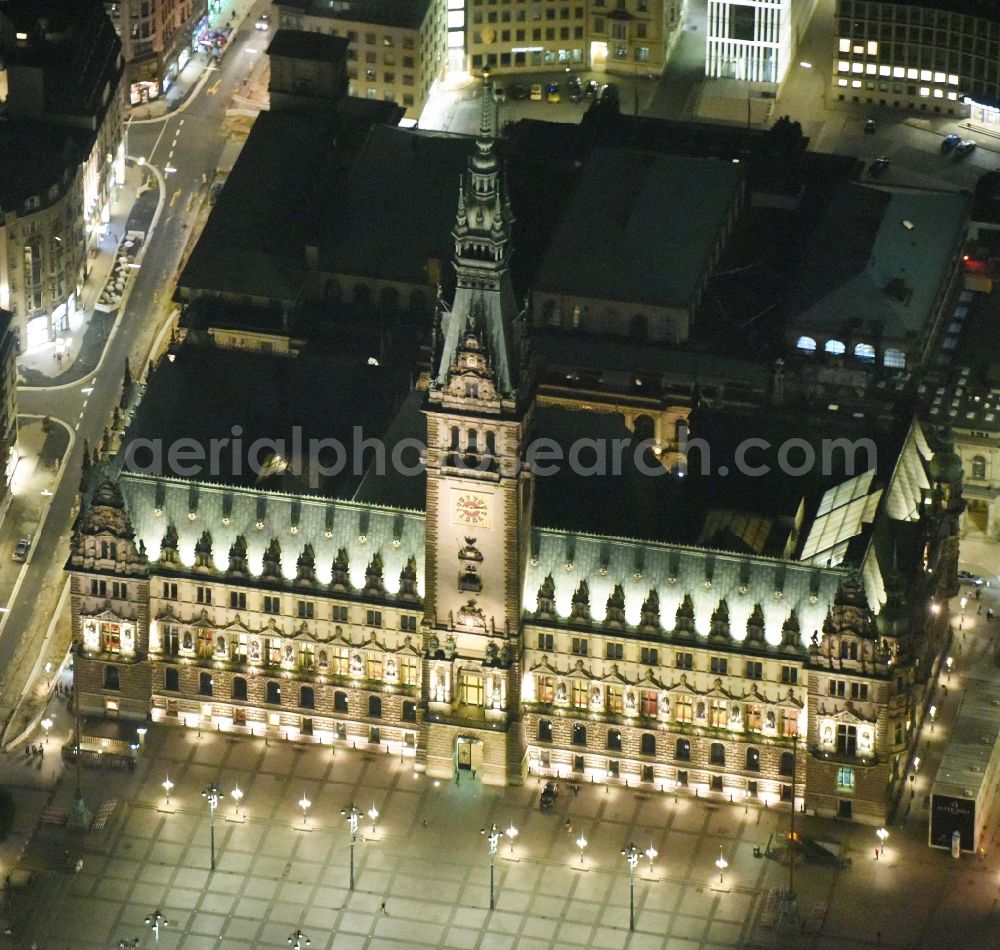 Aerial image at night Hamburg - Night view of Town Hall building of the City Council at the market downtown in Hamburg