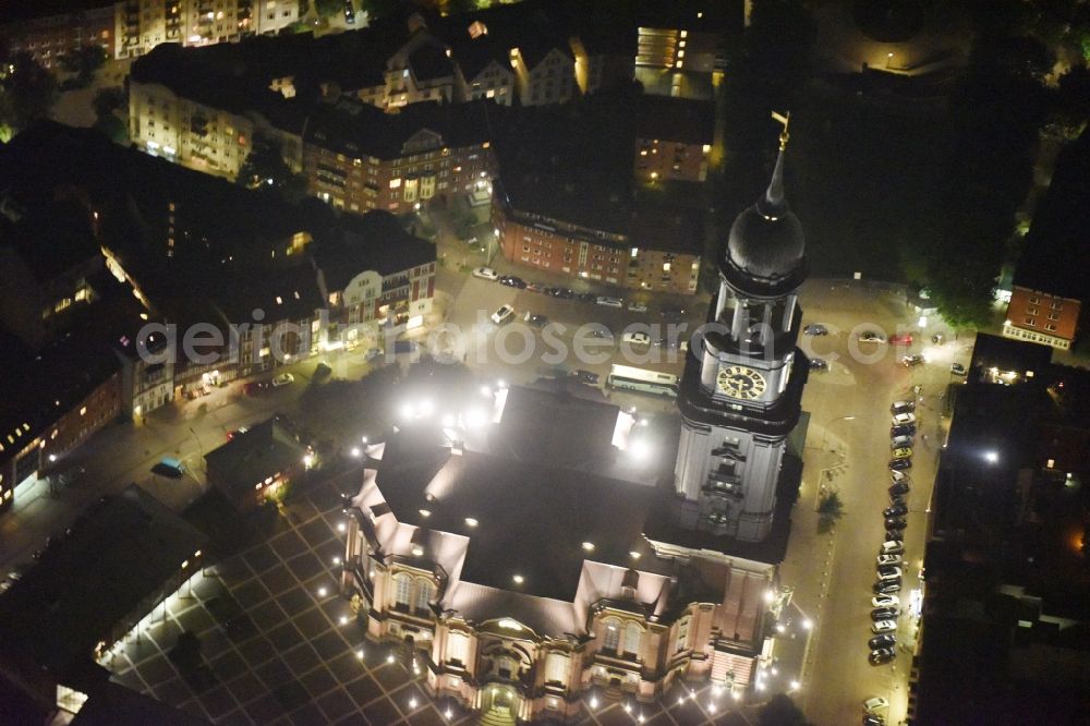 Aerial image at night Hamburg - Night view Church building Hauptkirche St. Michaelis on street Englische Planke in Hamburg