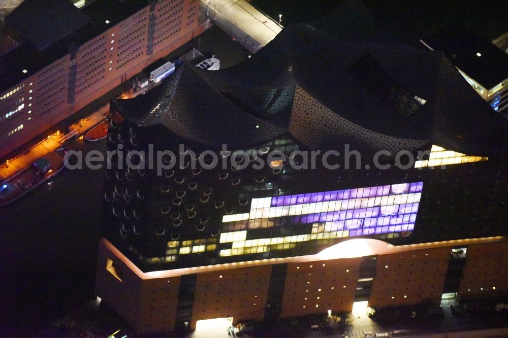 Aerial photograph at night Hamburg - Night view Concert Hall Elbphilharmonie on the place Platz der Deutschen Einheit square on the riverbank of the Elbe in Hamburg, Germany