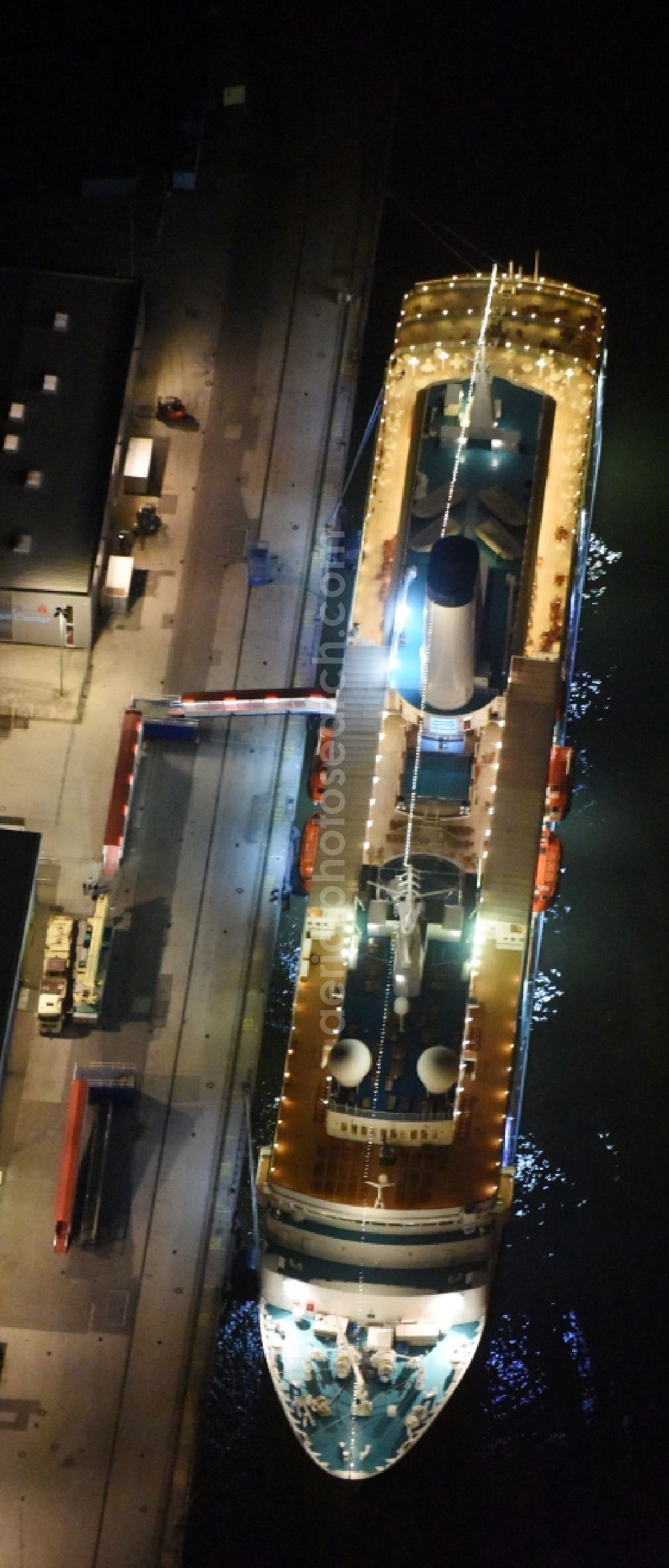 Hamburg at night from the bird perspective: Night view Passenger ship MS World Odyssey - formerly MS Deutschland on Hamburg Cruise Center in Hamburg