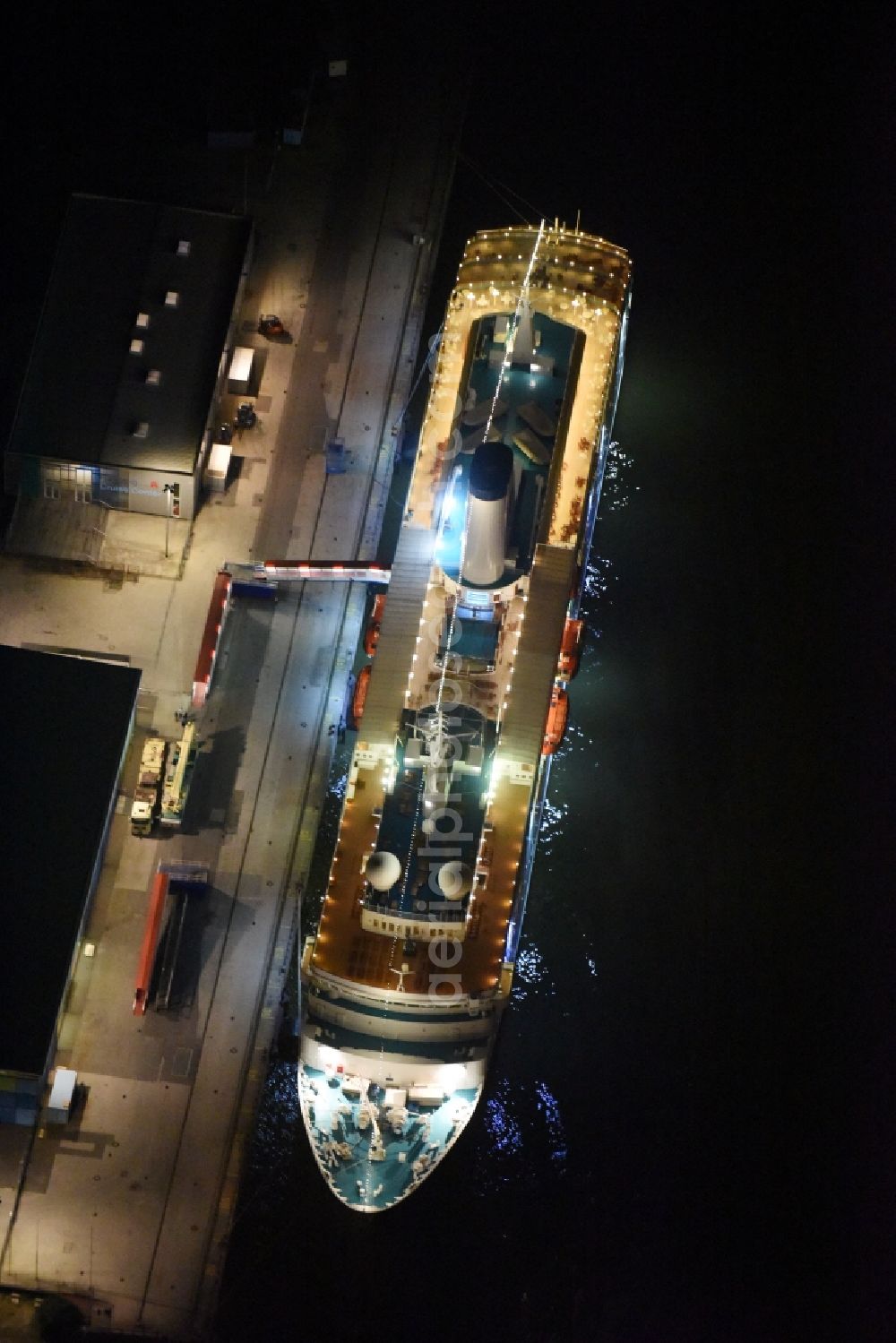 Aerial photograph at night Hamburg - Night view Passenger ship MS World Odyssey - formerly MS Deutschland on Hamburg Cruise Center in Hamburg