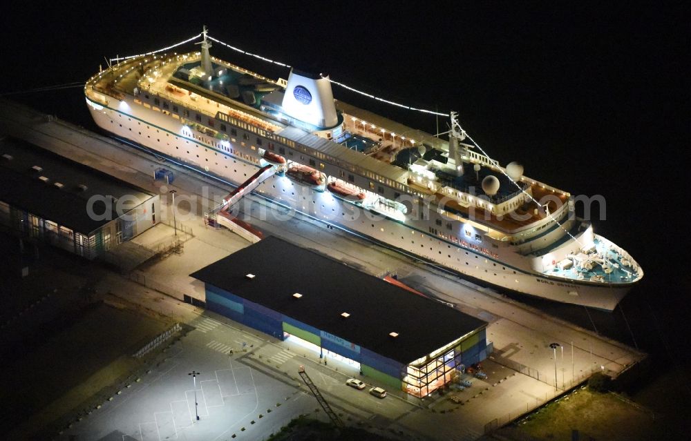 Aerial image at night Hamburg - Night view Passenger ship MS World Odyssey - formerly MS Deutschland on Hamburg Cruise Center in Hamburg