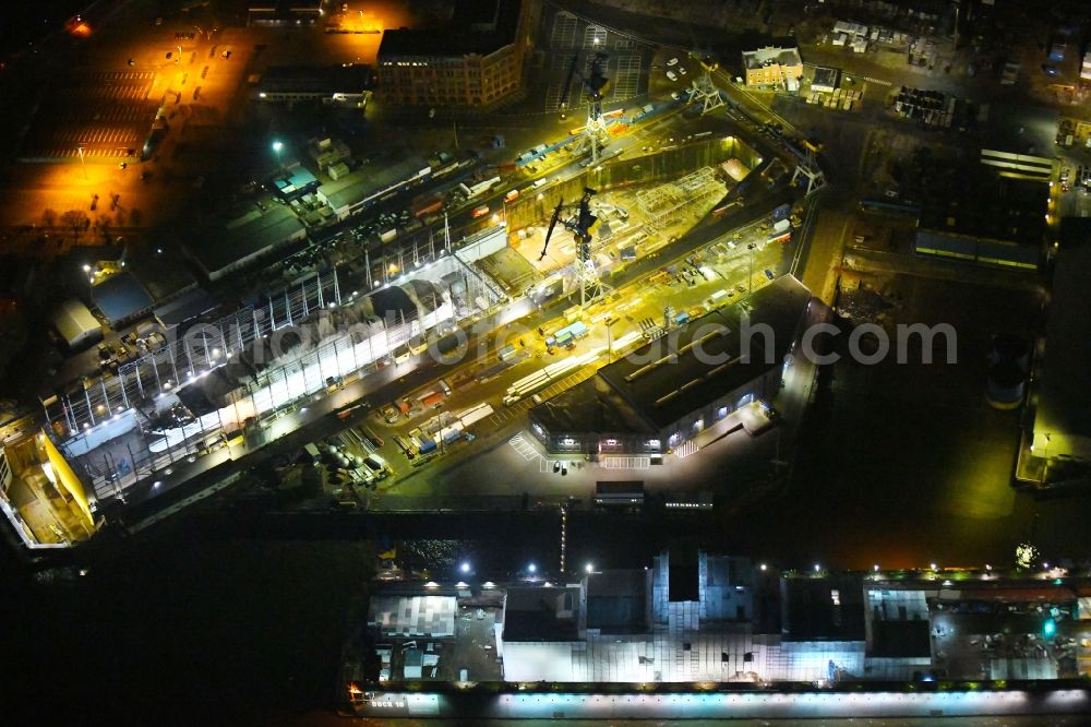 Aerial image at night Hamburg - Night lighting of the dry dock with luxury yacht a??Eclipsea?? at the Blohm and Voss Dock Elbe in Hamburg