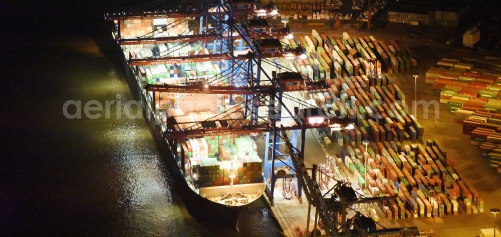 Aerial photograph at night Hamburg - Night view Container ship Trollerort - Steinwerder shore of Norderelbe port aerea in Hamburg