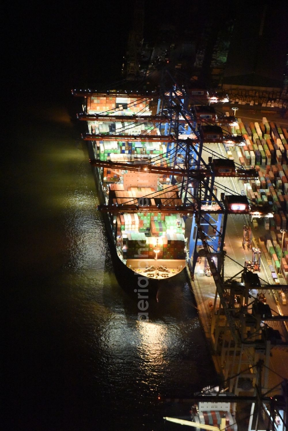 Hamburg at night from above - Night view Container ship Trollerort - Steinwerder shore of Norderelbe port aerea in Hamburg