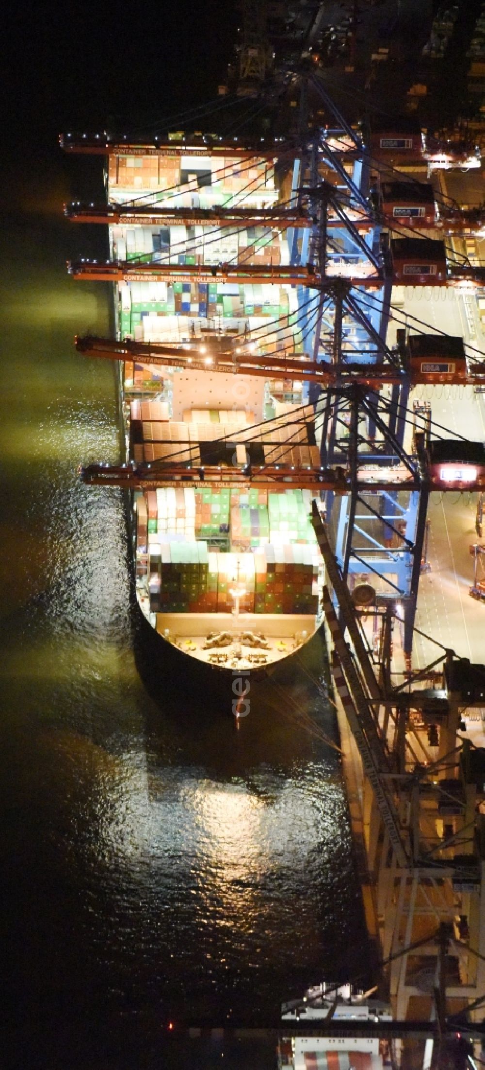 Aerial photograph at night Hamburg - Night view Container ship Trollerort - Steinwerder shore of Norderelbe port aerea in Hamburg