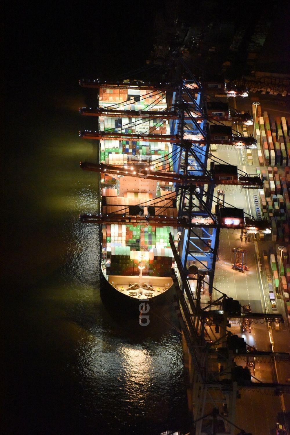 Aerial image at night Hamburg - Night view Container ship Trollerort - Steinwerder shore of Norderelbe port aerea in Hamburg